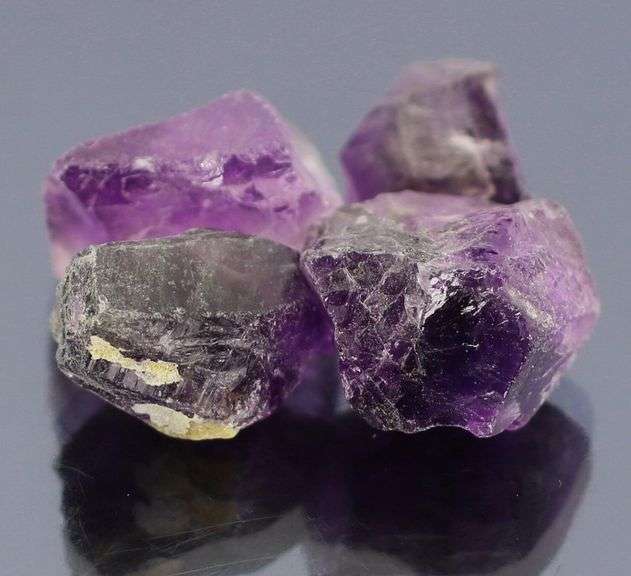 Rich untreated 50.64ct uncut Amethyst set