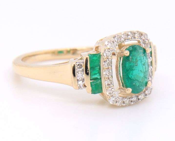 Gorgeous Yellow Gold Oval and Princess Cut Emerald and Diamond accent Ring