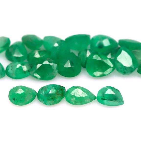 Pear cut 6.92ct Zambian Emerald set