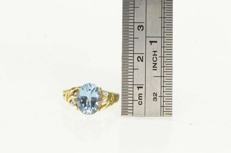 10K Yellow Gold Oval Blue Topaz Diamond Accent Bypass Ring