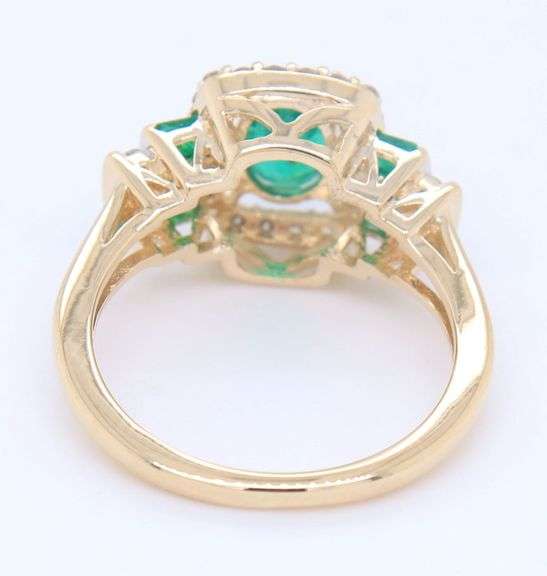 Gorgeous Yellow Gold Oval and Princess Cut Emerald and Diamond accent Ring