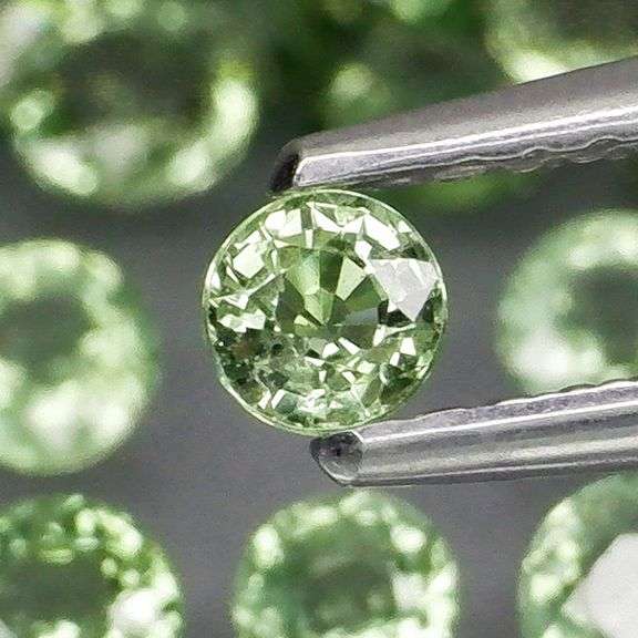 Awesome 6.96ct diamond cut GREEN Sapphire set