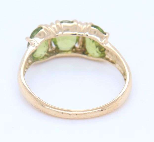 Gorgeous Yellow Gold Oval Peridot Three Stone Ring