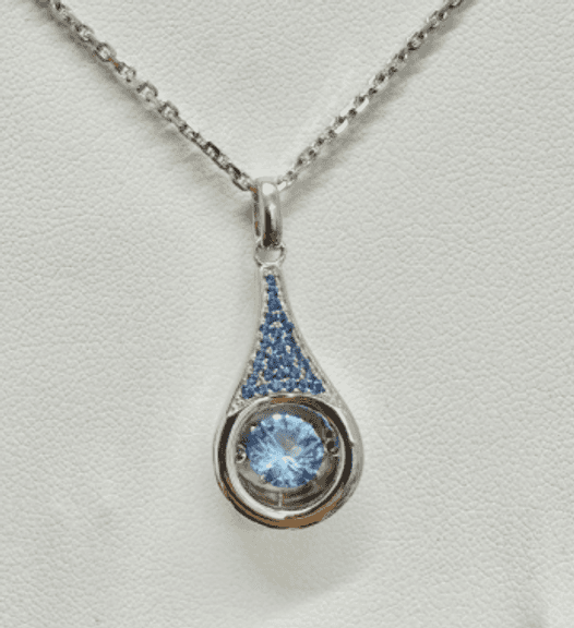 "Show stopper" solid sterling silver with fancy blue dancing center stone pendant