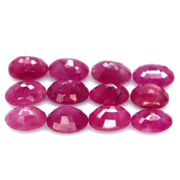 Heated only! 13.45ct violet red Ruby set