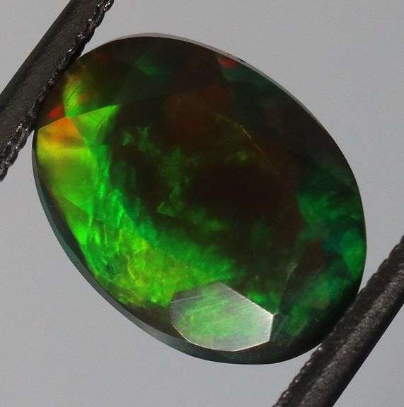Fully faceted full panel flashing 1.92ct oval cut Black Opal