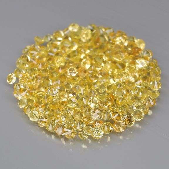 Fantastic 5.43ct diamond cut yellow Sapphire set