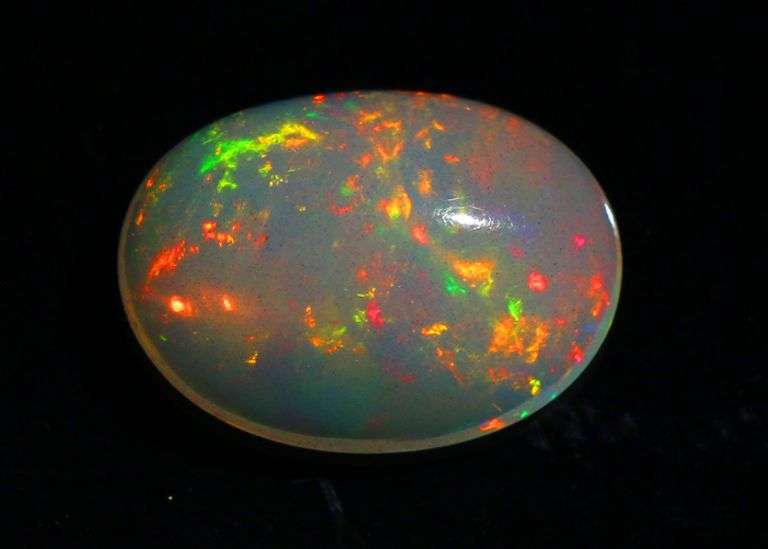 Magnificent 1.19ct full body flashing Semi Black Opal