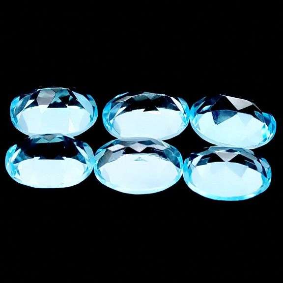 Bright 14.42ct sky blue Topaz set