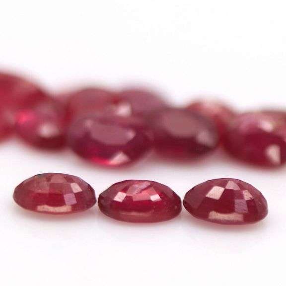 Rich 9.18ct oval cut imperial red Ruby set