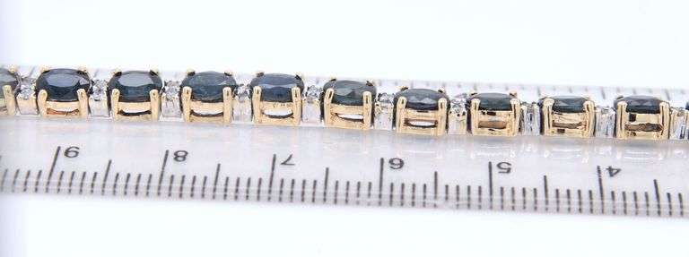 Attractive Yellow Gold Oval Blue Sapphire and Diamond accent Bracelet
