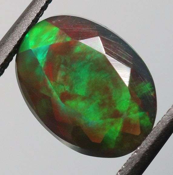 Fully faceted full panel flashing 1.92ct oval cut Black Opal