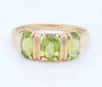 Gorgeous Yellow Gold Oval Peridot Three Stone Ring
