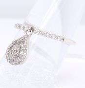 Dazzling Platinum Baguette and Round Diamond Dangle Ring