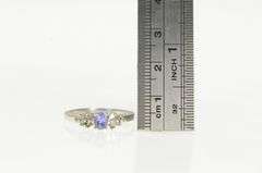 10K White Gold Oval Tanzanite Diamond Cluster Accent Ring