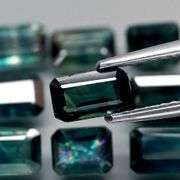 Heated only! 5.80ct blue green Sapphire set