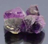 Rich untreated 50.64ct uncut Amethyst set