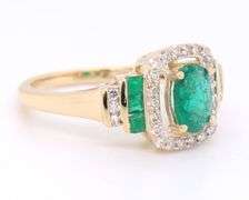Gorgeous Yellow Gold Oval and Princess Cut Emerald and Diamond accent Ring