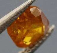 Stunning .39ct cushion cut amber Diamond