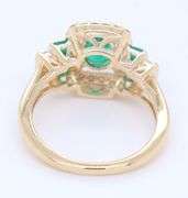 Gorgeous Yellow Gold Oval and Princess Cut Emerald and Diamond accent Ring