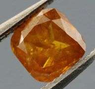Stunning .39ct cushion cut amber Diamond