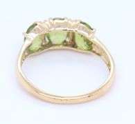 Gorgeous Yellow Gold Oval Peridot Three Stone Ring