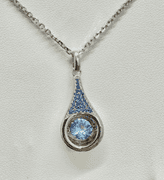 "Show stopper" solid sterling silver with fancy blue dancing center stone pendant