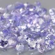 Heavy flashing 3.83ct diamond cut Tanzanite set