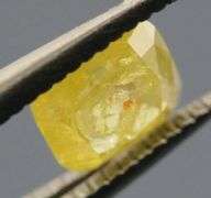 Glittering .32ct cushion cut golden yellow Diamond