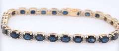 Attractive Yellow Gold Oval Blue Sapphire and Diamond accent Bracelet