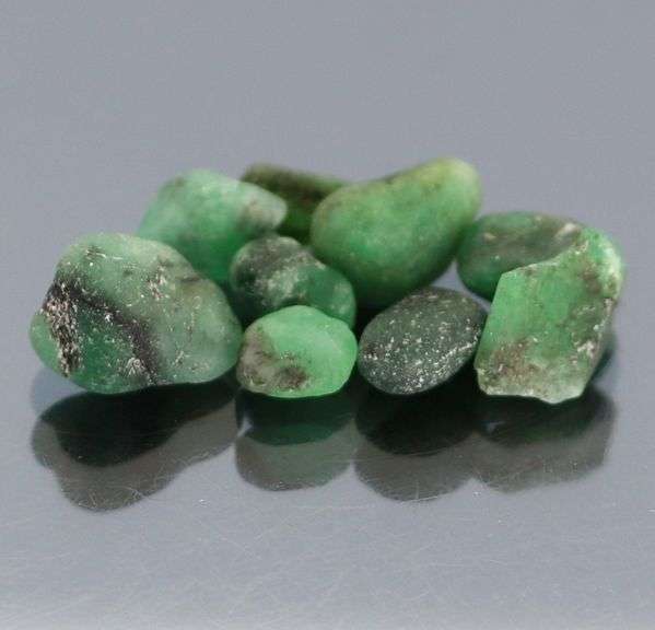 Collectable 10.90ct uncut Emerald set