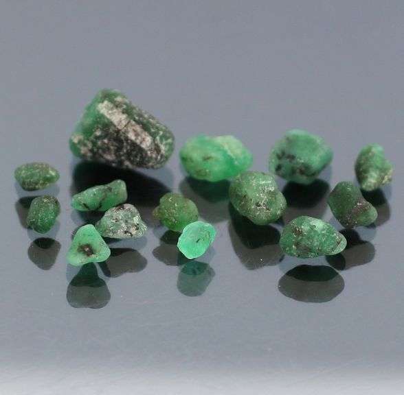 Untreated 10.13ct collectors uncut Emerald set