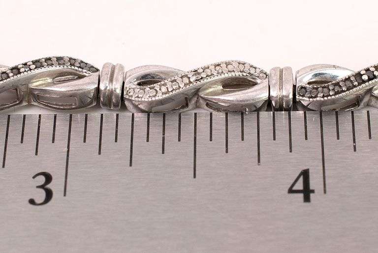 Sterling Silver Diamond and Blue Sapphire Infinity Bracelet