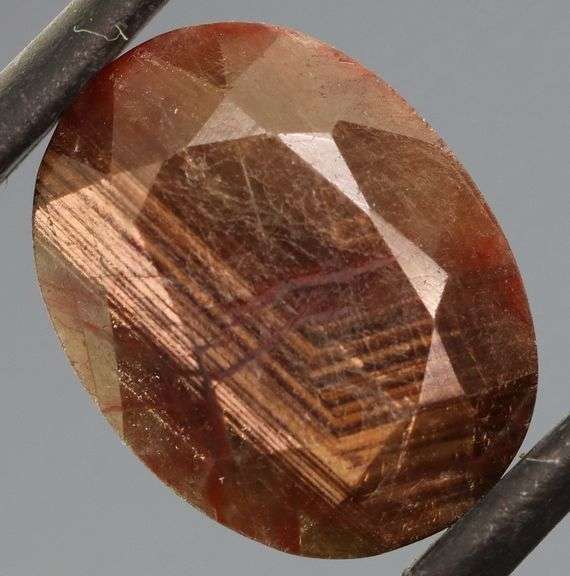 Shimmering metallic 9.12ct earth toned faceted Sapphire