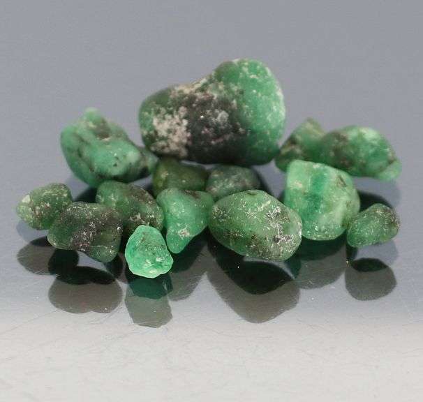 Untreated 10.13ct collectors uncut Emerald set