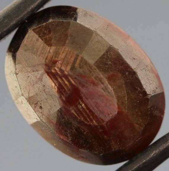 Shimmering metallic 9.12ct earth toned faceted Sapphire