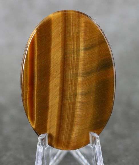 Mezmerizing 61.28ct Tigers Eye cabochon