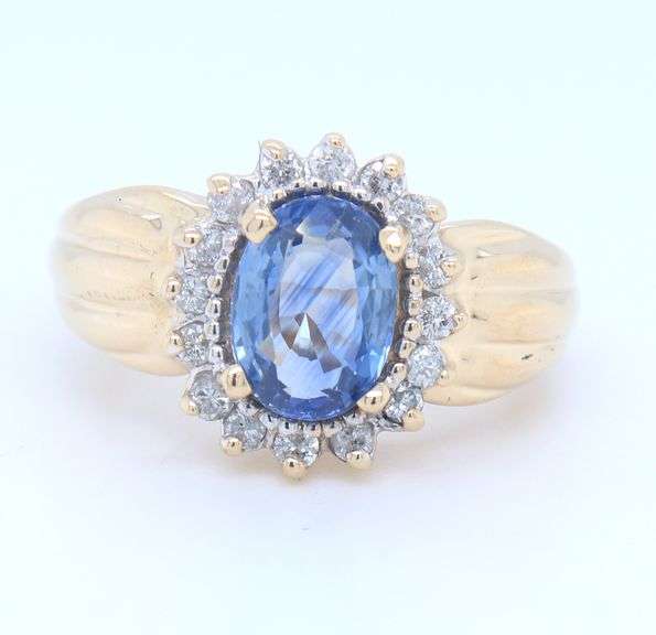 Handsome Yellow Gold 1.80ct Oval Blue Sapphire and Diamond Halo Ring