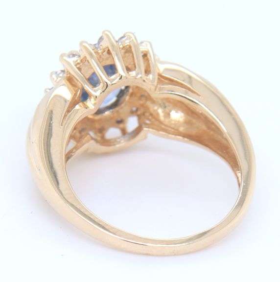 Handsome Yellow Gold 1.80ct Oval Blue Sapphire and Diamond Halo Ring