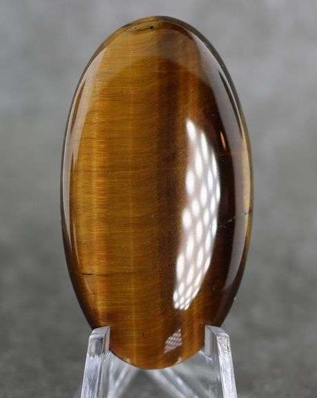 Full body shimmer! 64.19ct Golden Tiger Eye cabochon