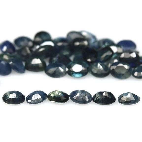 Heated only! 7.53ct blue green Sapphire set