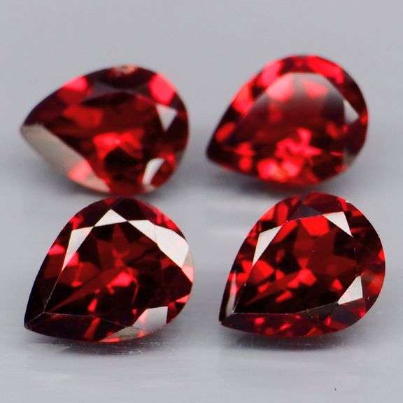 Premium 6.94ct pear cut cherry red Garnet set