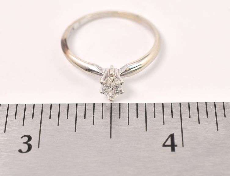 Delightful 14K white Gold Solitaire Diamond Ring