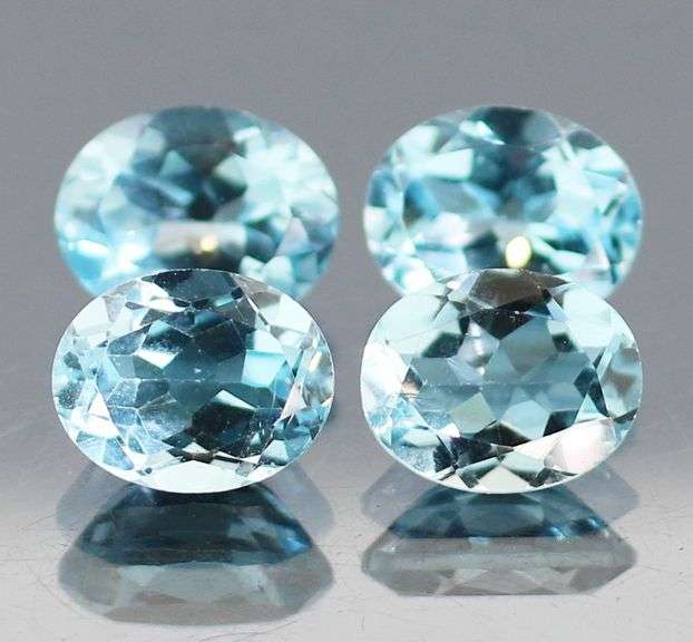Large 13.58ct vivid sky blue Topaz set