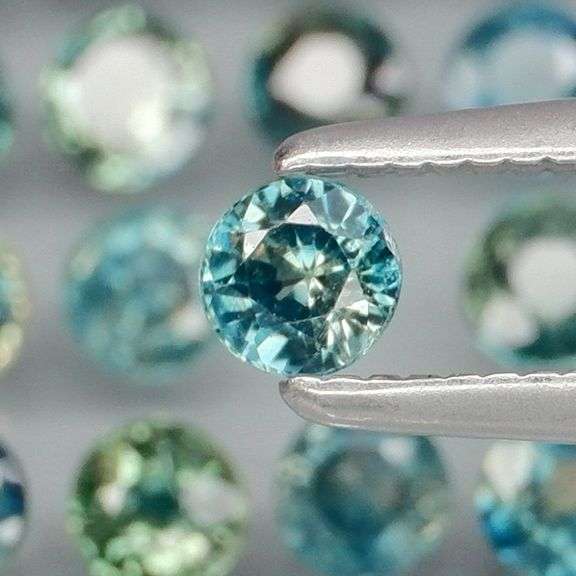 Heated only! 4.12ct blue green Sapphire set