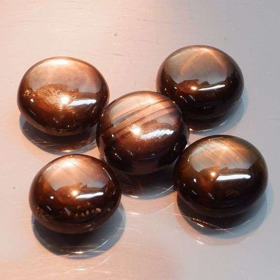 Stunning 7.49ct golden black Star Sapphire set