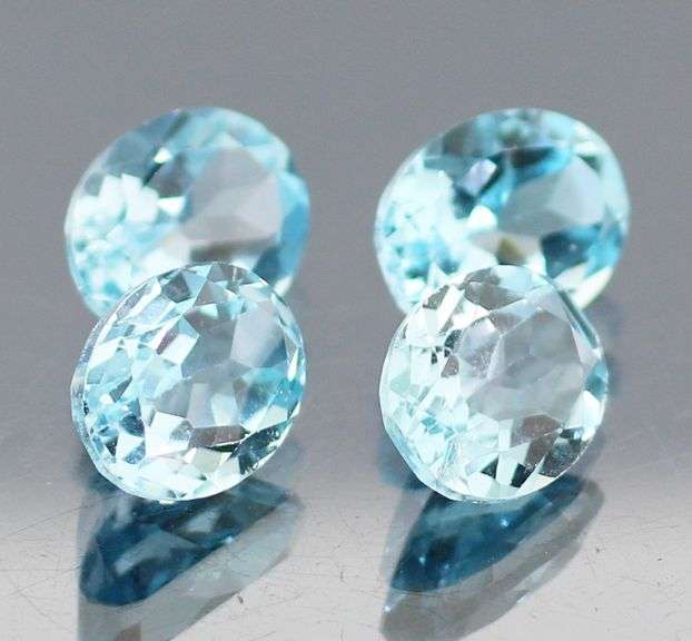 Large 13.58ct vivid sky blue Topaz set