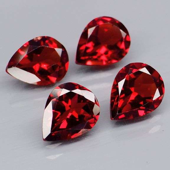 Premium 6.94ct pear cut cherry red Garnet set