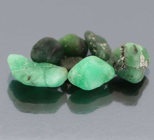 Untreated 11.23ct collectors uncut Emerald set