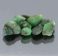 Collectable 10.90ct uncut Emerald set